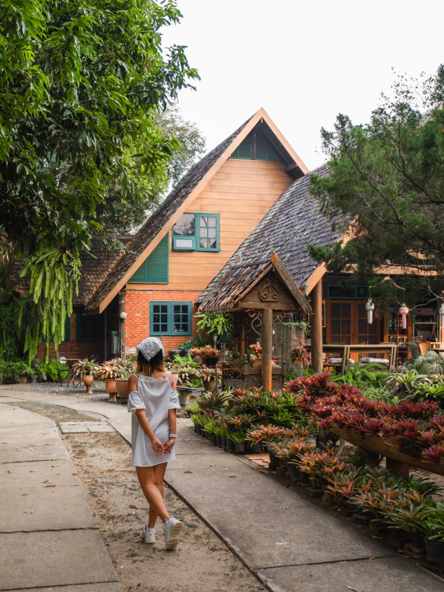 A woman strolling along a sidewalk