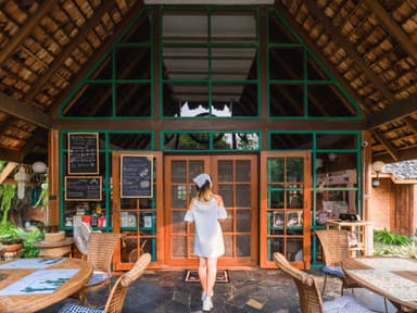 A woman walking into homestay lobby area