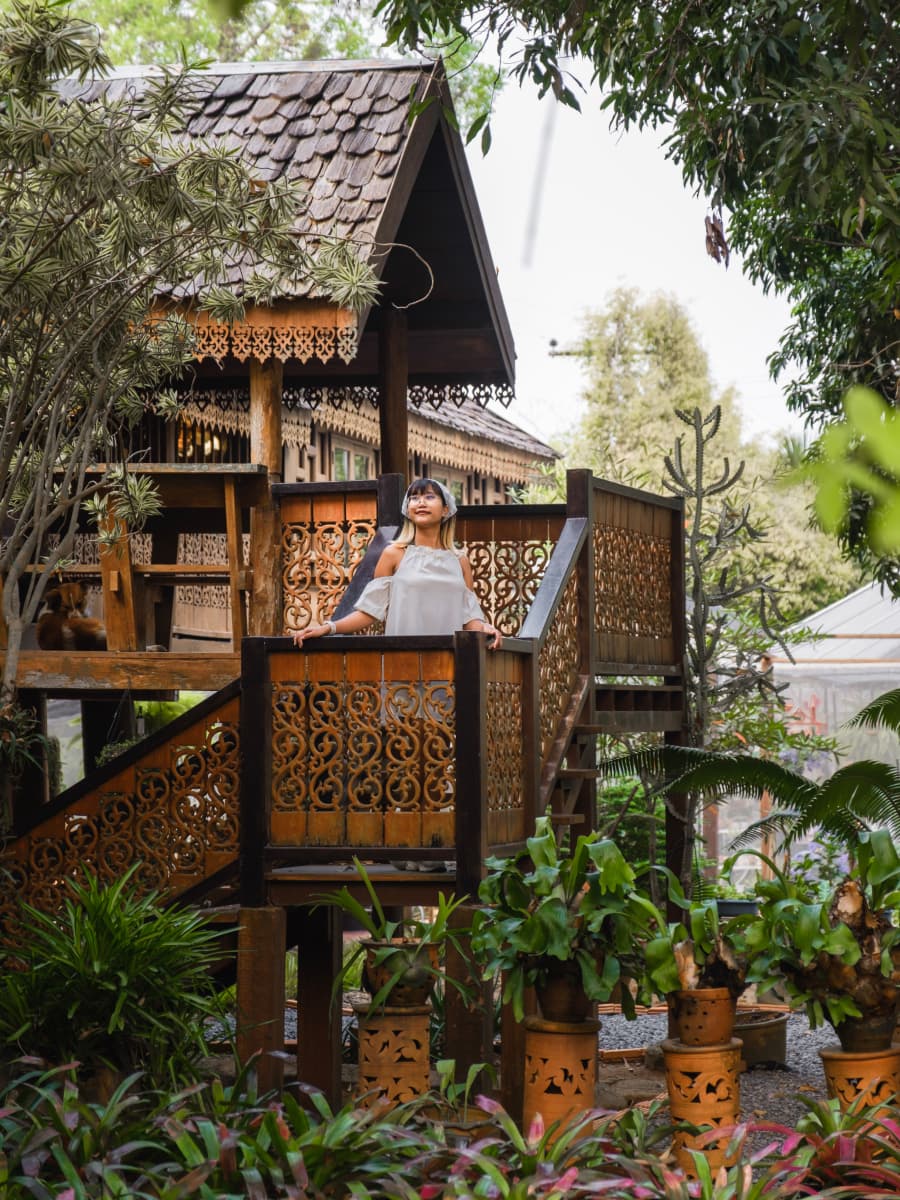 A woman standing on wooden stairs